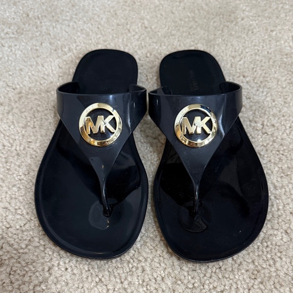 Michael Kors Shoes - Michael Kors Black Flip Flops with Gold Emblem